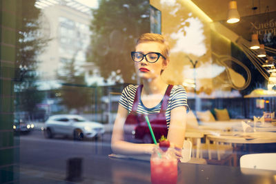 Woman looking away in city