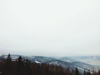Scenic view of landscape against sky during winter