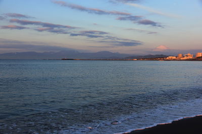 Scenic view of sea against sky at sunset