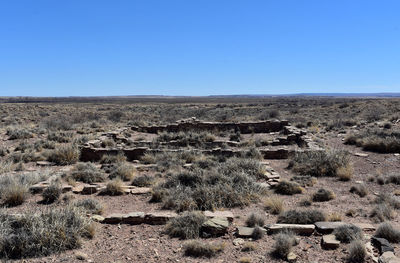 Ruin remains of a former structure in the landscape of the painted desert.