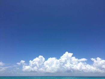 Scenic view of sea against blue sky