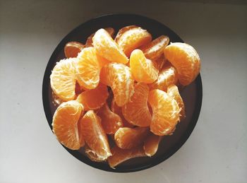 High angle view of orange slices in bowl