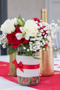 Close-up of roses in vase on table