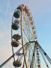 Low angle view of ferris wheel against sky