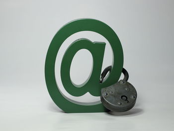 Close-up of telephone on table against white background