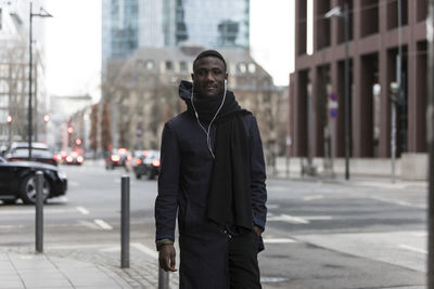 Man standing on city street