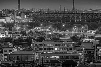 High angle view of illuminated buildings in city at night