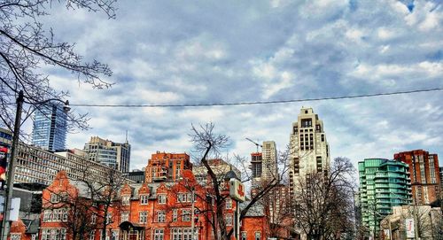 Low angle view of building against cloudy sky