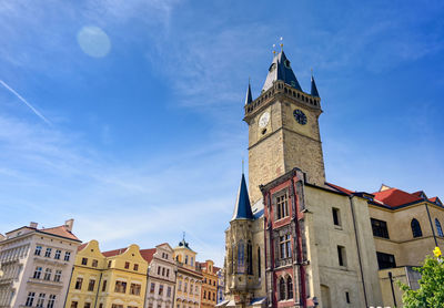 Low angle view of buildings against blue sky