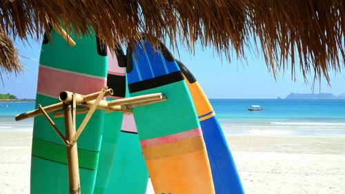 Scenic view of beach against blue sky