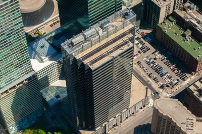 High angle view of modern buildings in city on sunny day