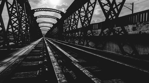 Railroad tracks against bridge