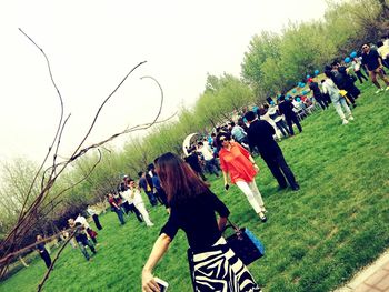 People on street against sky