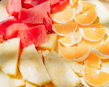 Full frame shot of chopped fruits in plate