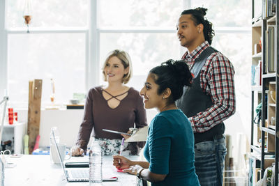 Colleagues looking away while having business meeting