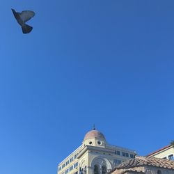 Low angle view of statue against clear blue sky