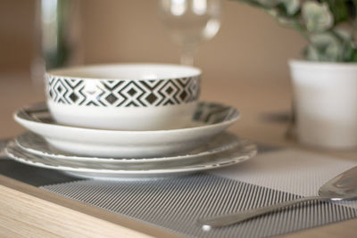 Close-up of coffee cups on table at restaurant