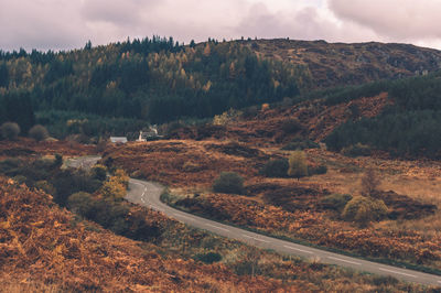 High angle view of road by mountain against sky