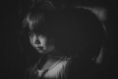 Close-up portrait of a girl looking away