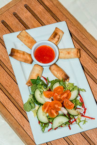 High angle view of vegetables in plate on table