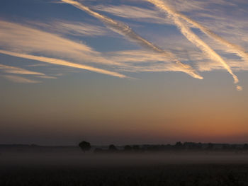 Scenic view of silhouette landscape against sky during sunset