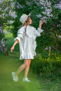 Full length of woman standing on field