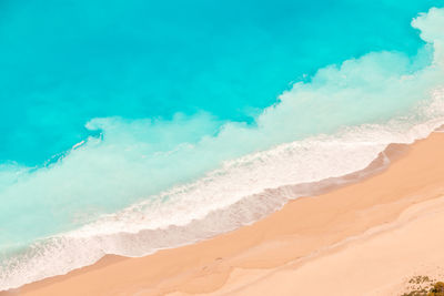 Scenic view of beach against blue sky