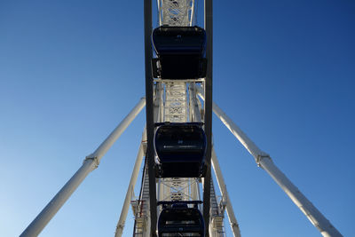 Ferris wheel against blue sky