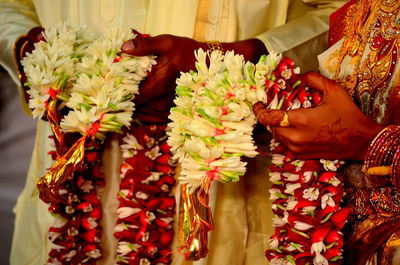 Close-up mid section of indian bride and groom