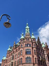 Low angle view of building against blue sky