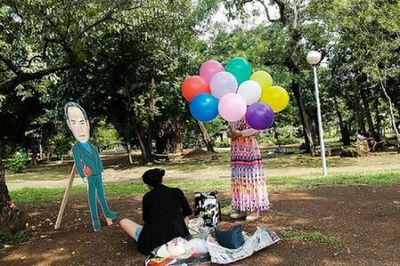 Rear view of boy playing in park