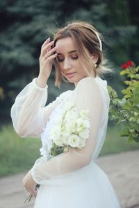 Woman holding flower bouquet