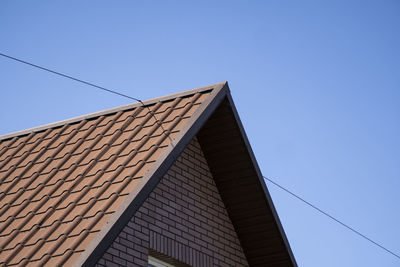 Low angle view of building against blue sky