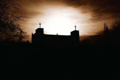 Silhouette of building against sky
