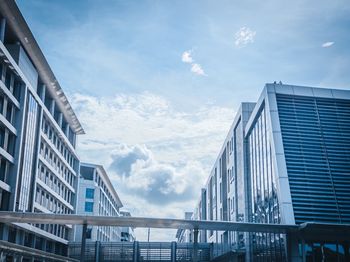 Low angle view of modern buildings against sky