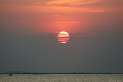 Sunset back onsilhouette red orange sky evening cloud and dark sky over horizon sea