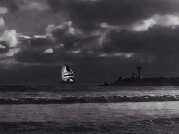 Scenic view of sea against cloudy sky