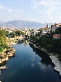 High angle view of river amidst town