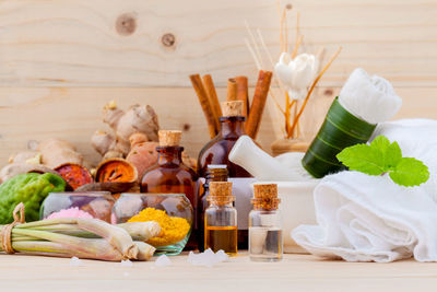 Spices with various objects on wooden table