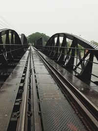 Railroad tracks against clear sky