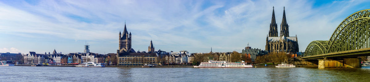 River amidst buildings against sky in city