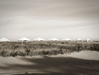 Built structure on beach against sky