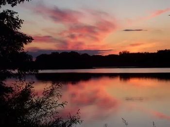 Scenic view of lake at sunset