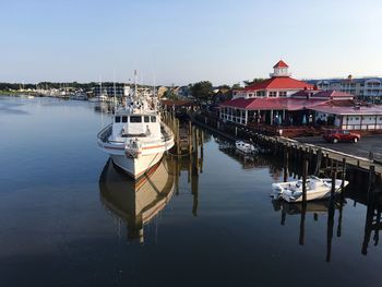 Boats moored at harbor