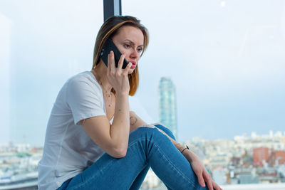 Young woman using mobile phone