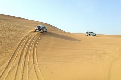 Car on desert land