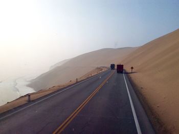 Road on mountain against clear sky