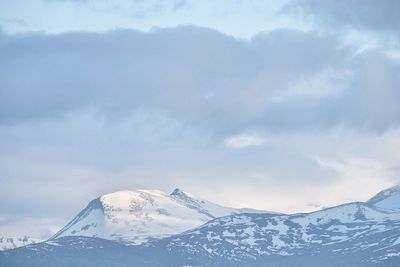 Idyllic shot of snowcapped mountains against sky