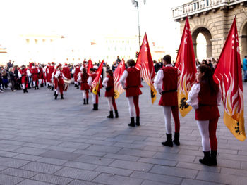 Rear view of people walking on street