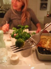 Midsection of woman preparing food in restaurant